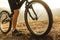 Crop man with bicycle in countryside