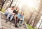 Crop photo of group of friends Millennials students teenagers sitting at city street, friendship, close up focus on feet