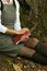 Crop view of atractive young universitarian woman with red book