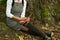 Crop view of atractive young universitarian woman with red book