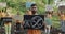 Crop view of bearded man holding placard with no 5g sign while standing in front of eco activists. Group of people with