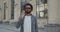 Crop view of handsome man with beard wearing stylish glasses and looking to camera. Portrait of afro american guy with