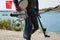 Crop view of scuba diver adult man on a seashore with spearfishing gear