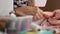 Crop view of woman working in home sewing machine