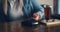 Crop woman paying for drink with smartphone