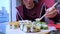 Crop young man eating sushi in restaurant