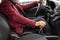 Cropped of aged man in suit driving car