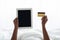 Cropped of black woman holding digital tabllet and credit card