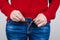 Cropped close up photo of woman trying to wear small size of denim trousers pants clothes outfit  grey background