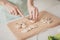 Cropped close-up view of female hands cutting new creative recipe making homemade useful weight loss dinner lunch in