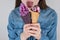 Cropped closeup photo of fun funny funky comic girl trying to eat two ice cream at the same time holding them in hands isolated