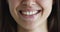 Cropped closeup view lower part face of young smiling woman