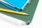 Cropped colorful folders with documents and bills and a yellow pencil on white table