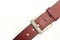 Cropped detail shot of a red leather belt on the white background
