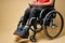 cropped disabled man sitting on wheelchair using smartphone