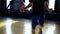 Cropped footage of a male boxer in blue shorts and leggings exercising in old style gym. Close up of man training with