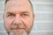 Cropped head shot of a bearded middle aged man