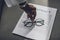 cropped image of african american businesswoman putting glasses on contract in office