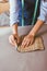 cropped image of beautiful seamstress making pattern with piece of chalk