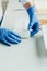 cropped image of biologist in latex gloves working at table with seeds in agro