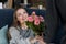 cropped image of boyfriend presenting bouquet of roses to girlfriend