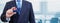 Cropped image of businessman holding plastic credit card with printed flag of Cook Island. Background blurred