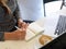 Cropped image, Businesswoman works during coffee break at coffee shop