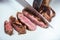 cropped image of chef cutting fried meat with knife