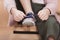 cropped image of child tying lace on sneaker while