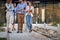 Cropped image of colleagues  walking, talking and laughing in front of business building