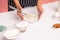 Cropped image of cooker holding glass bowl with ingredients for dough with corolla, preparing cakes or biscuits, preparing tasty