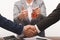 cropped image of costumer and estate agent shaking hands, realty buying concept