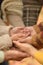 Cropped image, family putting hands together close up