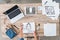 cropped image of female designer putting painting on table with laptop and digital tablet with linkedin