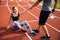 Cropped image of a fitness man with water bottle helping