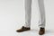 cropped image of male model in linen trousers and suede shoes