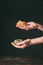 cropped image of man holding raw tagliatelle on hand palms over table