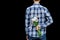 Cropped image man`s hand behind his back with bouquet of wild flowers. Touchingly surprise, gift for your loved one, woman`s day