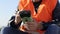 Cropped image of man working with geodetic equipment