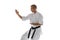Cropped image of one caucasian sportsman training isolated over white background. Karate, judo, taekwondo sport