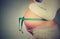 Cropped image pregnant woman with measuring tape around her belly