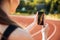 Cropped image of sportswoman making selfie photo on mobile phone