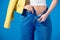 cropped image of stylish girl unbuttoning jeans