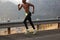 Cropped image of unrecognizable active black male photographed in motion, jumps highly, has muscular body shape