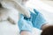 cropped image of veterinarian in latex gloves examining dog