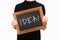 Cropped image of woman holding chalkboard with lettering idea