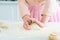 cropped image of woman kneading dough