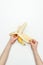 cropped image of woman peeling banana