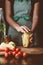 cropped image of woman preparing preserved bell peppers