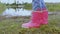Cropped Little girl in rain boots near lake